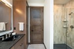 The primary bathroom features walk-in shower, double vanity & heated floors.
